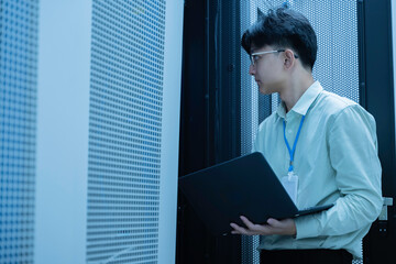 computer engineer is setting up network in server room,systems maintenance technician,male engineer 