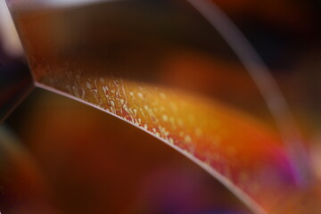 Fototapete - 	
Orange coloured liquid surface, fluid effect, bright chemistry, geometric shapes