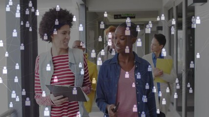 Poster - Women guiding team down office hall after tapping tablet, discussing project data with smartphone
