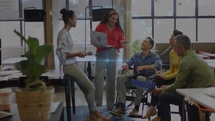 Poster - Coworkers aligning next steps in office, presenter gesturing to screen while peer scrolling tablet