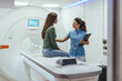 © Dragana Gordic - Healthcare Technician Assisting Woman During CT Scan Procedure in Modern Facility