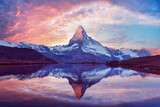 Stellisee lake glows at sunset with perfect Matterhorn reflection in clear alpine water. Swiss Alps evening view near Zermatt with golden light and snowy peak Stellisee lake glows at sunset with perfect Matterhorn reflection in clear alpine water. Swiss Alps evening view near Zermatt with golden light and snowy peak