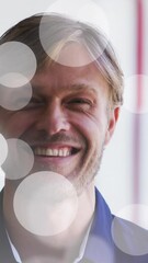 Poster - Animation of light spots over caucasian man smilig