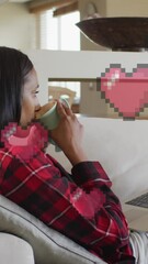 Poster - Animation of digital heart icons over woman using laptop on video call