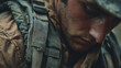 © Desmilka - Gritty close-up cinematic portrait of a weary soldier in combat gear, his face showing the strain and exhaustion of battle