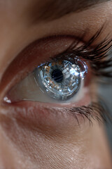 Poster - Close-up of smart contact lenses with AR interface projected in eye reflection, minimal futuristic background