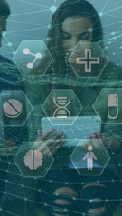 Poster - A team of executives is using electronic devices in an office