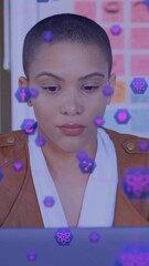 Poster - Animation of network of digital icons against woman using laptop at office