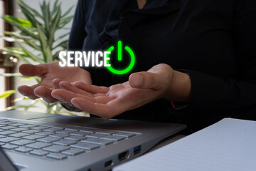 Poster - Close-up of hands holding a laptop with a green power button and the words 