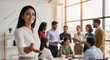 © redtiger9 - Confident indian hr manager inviting to join team meeting in office
