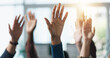© peopleimages.com - Hands raised, question and group of business people in meeting as audience for volunteering or answer. Gesture, team and vote in office with idea, engagement and feedback of employees at workplace