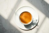 Overhead view of coffee in a cup, subtle translucent shadow, beverage, drink