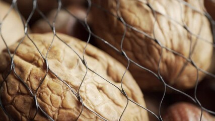 Assorted netted shelled nuts extreme close up stock footage