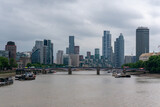 skyline from modern london uk with skycraper and the thames river typical English weather