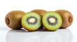 © elkhan - Juicy kiwifruit, whole and halved, glistening with water droplets, arranged on a reflective white surface.