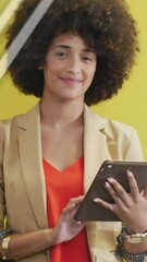 Poster - Animation of financial data processing over businesswoman using tablet