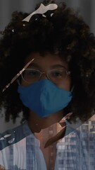 Poster - Animation of shapes over african american woman and cityscape
