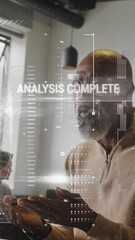 Poster - Animation of graphs, texts, computer language over african american man working on laptop in office