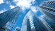 © natalikp - Looking Up modern high-rise office buildings with blue sky in the background