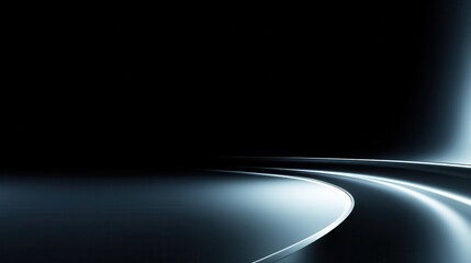 Poster - Abstract view of a smooth, curving road under low light with a minimalist black background