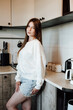 © Виктория - young woman in kitchen, very beautiful girl with long hair in a bright kitchen