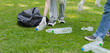 © Nittaya - People Collecting Plastic Bottles in Park