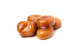 © New Africa - Tasty sweet candies and caramel sauce isolated on white