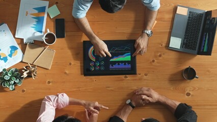 Poster - Top aerial view of business man present financial graph to group of smart investors. Professional male leader analyze graph and explain marketing idea by using tablet on meeting table. Convocation.
