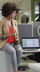 Poster - Animation of multiple digital icons against two diverse women discussing at office