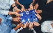 © InfiniteFlow - This image captures the essence of collaboration and management as hands come together to connect puzzle pieces, symbolizing teamwork and strategic business development. Amity