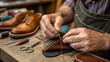 © Drago Designer - A skilled shoemaker is meticulously handsewing leather shoes in a traditional workshop