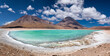 © Travel 'n' Lifestyle - View of turquoise lake water meeting white shorelines under a bright blue sky with majestic mountains, Potosi, Potosi Department, Bolivia.