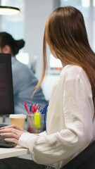 Poster - Vertical video Young programmer in office requests help from IT experts detecting and blocking hacker intrusion. Intern assisted by staff members coordinating incident response for network attack