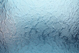 Frosted glass texture with blue tint, abstract pattern, smooth and foggy surface, transparent material, modern and calming background for design
