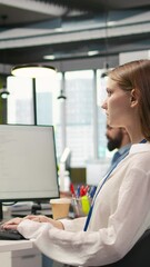  - Vertical video Female technician testing generative AI machine learning algorithms at work. IT professional scaling productivity with artificial intelligence large language model written code, camera