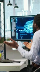 Poster - Vertical video Programmer requests help from team leader to fix hacking attempt on corporate network. IT employee and manager investigating unauthorized access alerts, doing brainstorming, camera A