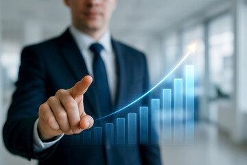 Poster - Businessman pointing at glowing upward financial graph suit finger