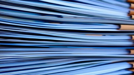 Poster - Tilted stack of blue papers, close-up