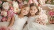© Ben Kuang - Two girls with blonde hair in elegant white dresses among pink floral decorations.