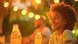 © MKM Creative - Joyful Child with Drink at Outdoor Evening Gathering