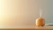© MKM Creative - Aromatherapy Diffuser Emitting Steam on Wooden Table