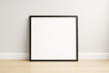 Aufkleber - Blank black frame leaning against light wall on wooden floor in modern empty room interior for mockup or branding presentation concept.