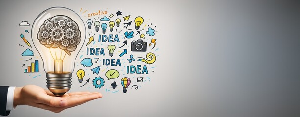 Aufkleber - Business hand holding light bulb with creative idea icons, gears and brain concept sketched on bright background with copy space for design template.