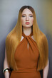 © fStop - Formal portrait of beautiful young woman with long, sleek red hair
