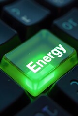 Poster - A glowing green energy button on a dark keyboard, vertical composition. This vibrant image is perfect for illustrating concepts of power, technology, and sustainability.