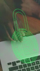Fototapete - animation of padlock icon and data processing over diverse people using laptops