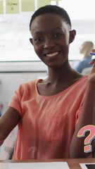 Poster - Animation of question marks over african american businesswoman working at office