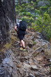 © Xalanx - Hiker ascending basalt trail in Anaga