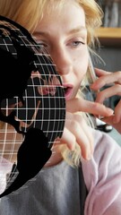 Poster - Animation of globe spinning over woman using smartphone