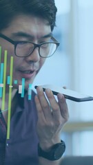 Poster - Animation of statistical data processing against asian man talking on smartphone at office